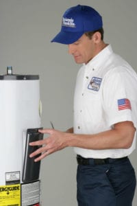 A Ben Franklin plumber performs a water heater replacement.