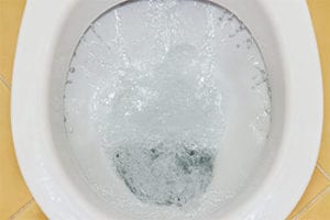 Toilet bowl with running water, illustrating a common plumbing issue of continuous water flow after flushing, relevant to home plumbing repairs.