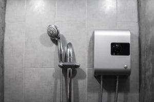 Ben Franklin Plumbing Tyler shows a photo of an electric tankless water heater in a shower.