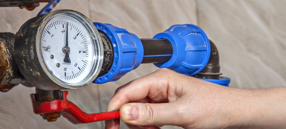 A photo of someone checking the water pressure gauge.